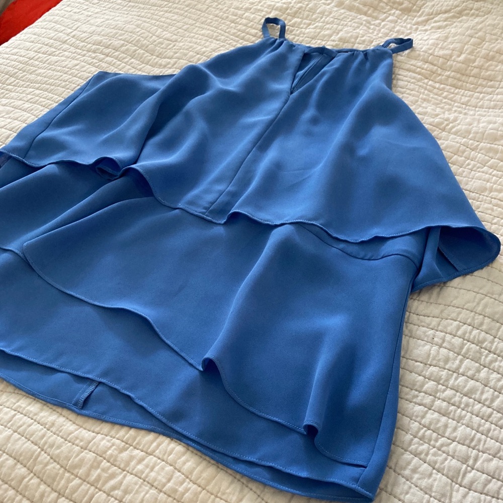 Vibrant sleeveless blouse from Saks